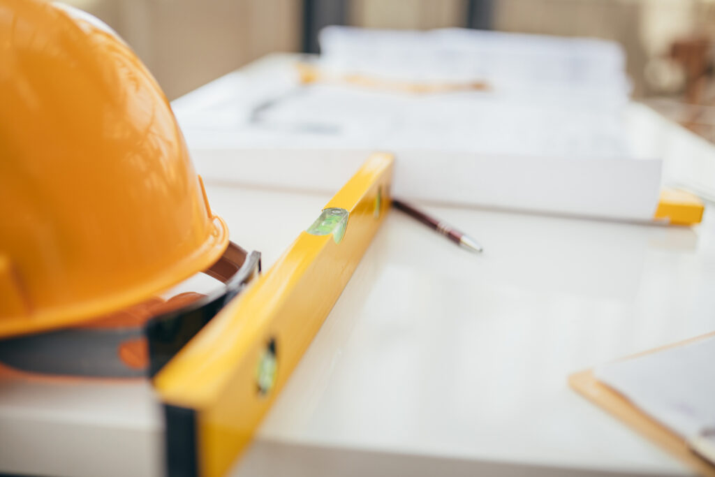 Table with hard-hat and blueprints from Central Illinois Construct for a Pekin IL project