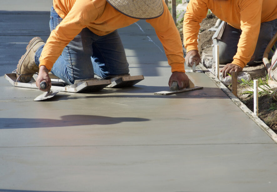 Members of Central Illinois Construct work on building new sidewalks in Illinois