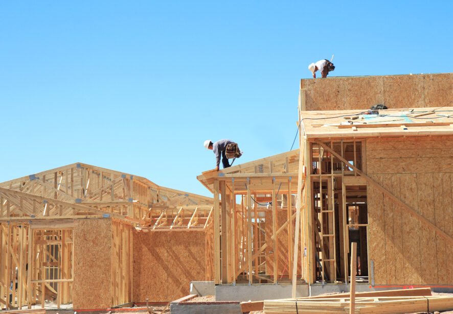 A house being framed in a neighborhood by Central Illinois Construct, home builders in Peoria IL