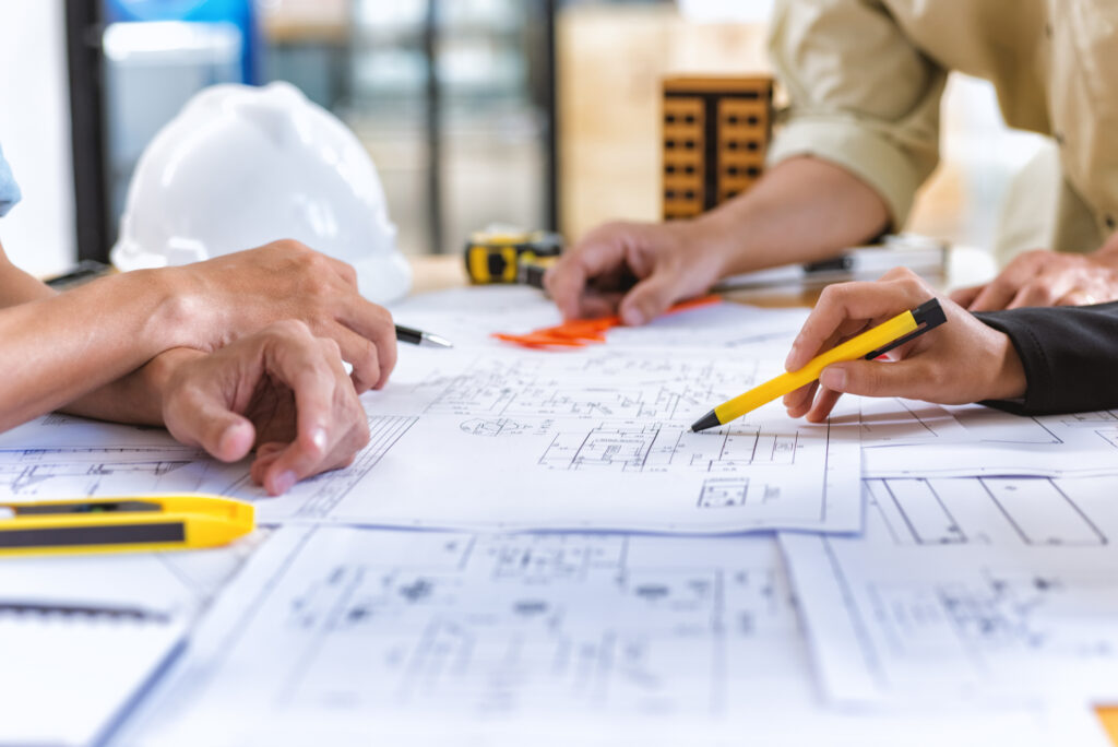 Construction team checks over blueprints for a project in Washington IL
